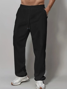 Men's solid black cotton casual pants with elastic drawstring waist and straight fit