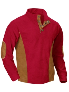 Vista detallada de la sudadera de pana roja con bloques de color camel en las mangas