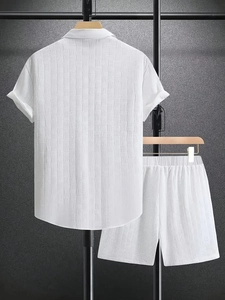 Detail of white men's leisure set featuring rich textured waffle weave fabric and elastic waist