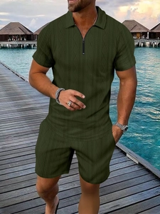 Detail of dark green polo and shorts set with textured diamond knit pattern fabric