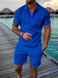 Detail of royal blue men's polo set with textured 3D geometric knit fabric at a resort