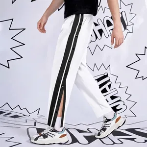 Men's white hip hop straight pants with black side stripes and functional snap buttons