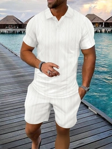 Close-up of white summer polo set featuring textured geometric jacquard fabric details