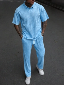 Close-up of sky blue jacquard knit polo shirt and trousers set with cable texture