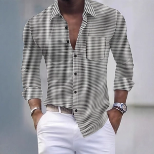 Detail of men's slim fit long sleeve shirt featuring black and white gingham pattern and pocket