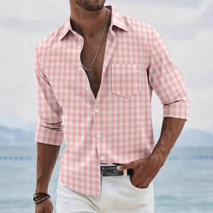 Men's pink gingham short sleeve shirt with chest pocket and white buttons outdoors