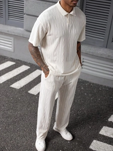 Close-up of cream textured vertical geometric cable knit on men's polo set