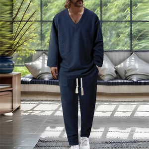 Men's navy blue lounge set featuring V-neck long sleeve top and drawstring pants with texture