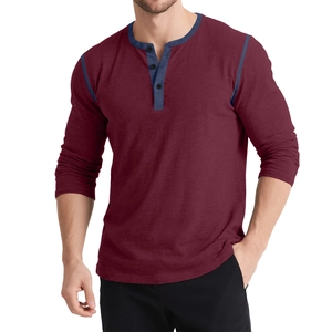 Close-up of contrast blue stitching and three buttons on burgundy long sleeve Henley shirt
