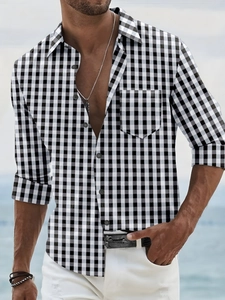 Detail of men's gingham long sleeve shirt with front pocket and button-down collar