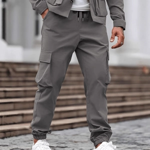 Men's slim fit cargo pants in cool grey with drawstring waist and multi-pocket design