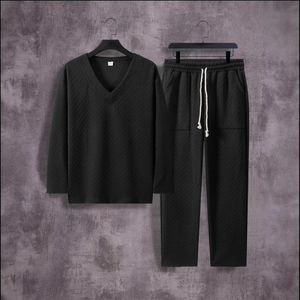 Men's black long sleeve V-neck top and trousers set with textured herringbone knit fabric