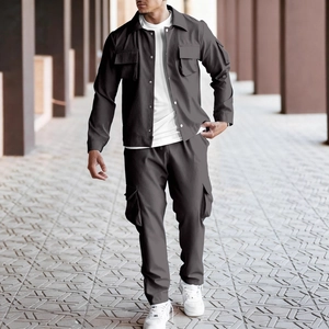 Detail of cargo jacket with chest pockets and matching pants in urban utilitarian style
