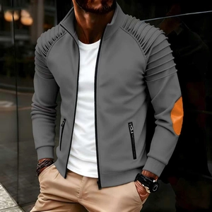 Detail of men's grey jacket featuring pleated shoulders and orange elbow patch accents