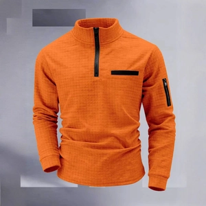 Men's orange waffle knit quarter-zip polo shirt with a functional sleeve pocket