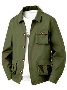 Detail of army green military jacket featuring classic collar and functional multi-pockets