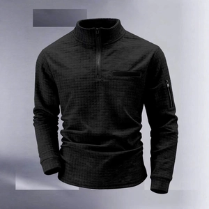 Men's black waffle-knit polo shirt with quarter-zip collar and sleeve pocket detail