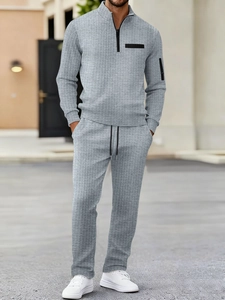 Men's grey waffle knit tracksuit with stand collar half-zip top and matching trousers