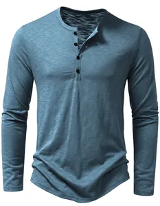 Close-up of sky blue linen-cotton men's long sleeve Henley shirt with slub texture
