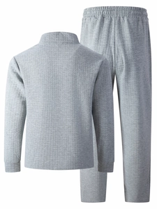 Detail shot of men's grey polo tracksuit showing the quilted texture and arm zipper