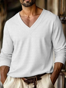 Close-up of white V-neck long sleeve shirt featuring a 3D basket weave jacquard texture