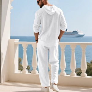 Rear view of white linen men's hooded casual suit on a scenic balcony with sea background