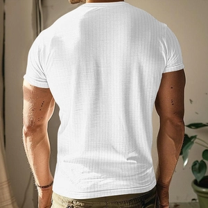 Detail of white men's knit T-shirt showing vertical ribbed texture and slim fit back profile