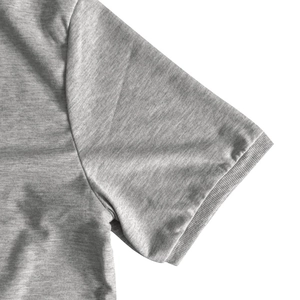 Detailed close-up of heather grey knitted fabric and ribbed cuffs on men's T-shirt