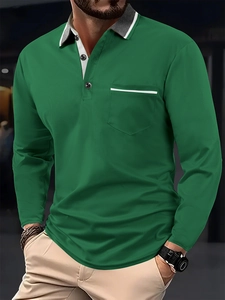 Detail of dark green waffle knit polo shirt with grey contrast collar and chest pocket