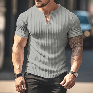 Detailed view of grey short sleeve Henley shirt with knit texture and button collar