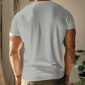 Rear view of a men's light grey short sleeve Henley shirt with vertical ribbed texture