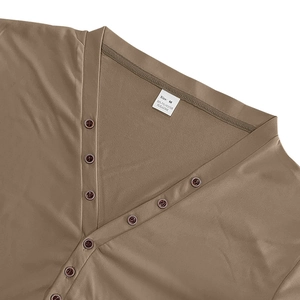 Macro detail of Henley shirt neckline with vintage buttons and fabric composition label