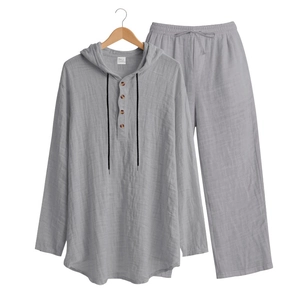 Detail of grey linen-blend long sleeve Henley shirt with hood and drawstring waistband pants