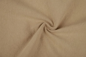 Macro shot of khaki linen fabric texture showing natural breathable plain weave details