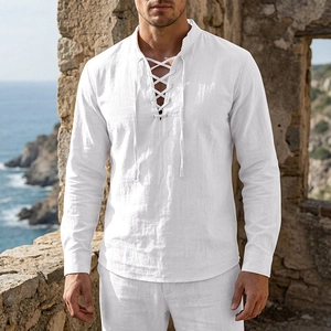 Close-up of white linen Henley shirt featuring lace-up V-neck and vintage fabric texture