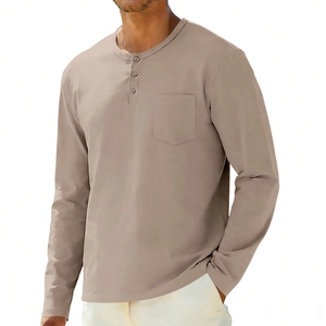 Detail of the three-button henley collar and chest pocket on a casual long sleeve shirt