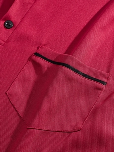 Men's red long sleeve golf polo shirt featuring a textured piqué fabric and chest pocket