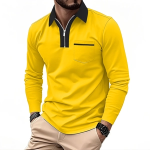 Close-up of yellow long sleeve polo shirt featuring black zip collar and chest pocket detail