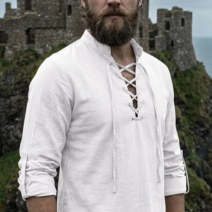Detail of white linen henley shirt showing lace-up V-neck and textured fabric
