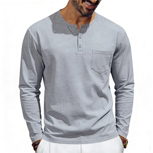 Detail of grey long sleeve Henley shirt featuring three buttons and a front chest pocket