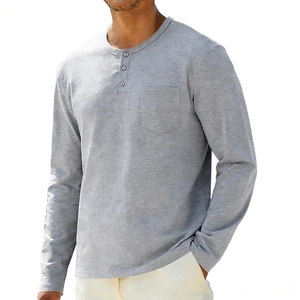 Detailed close-up of gray Henley shirt with three buttons and chest pocket texture
