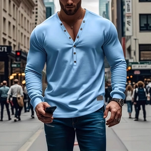 Close-up detail of light blue slim fit Henley shirt with seven-button neckline and hem tag