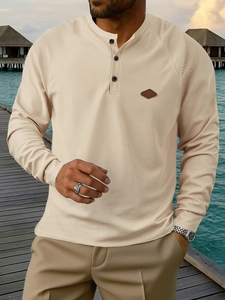 Men's apricot waffle knit Henley shirt with long sleeves and decorative chest patch