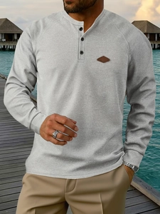 Light gray waffle knit Henley shirt for men with three-button neckline and raglan sleeves