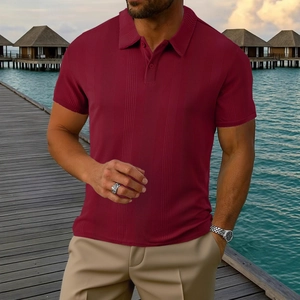 Detail of burgundy short sleeve polo shirt showing vertical ribbed texture and lapel