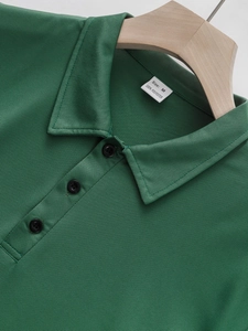 Classic dark green polo shirt in breathable mesh fabric with turn-down collar and buttons