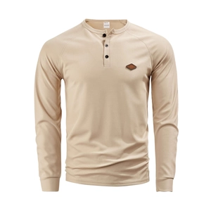 Detailed view of men's waffle knit Henley shirt collar and brown leather logo patch