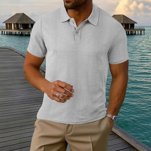 Detail of light grey textured knit polo shirt with buttoned collar on island background