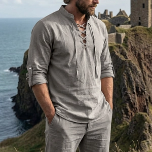 Close-up of gray linen Henley shirt with lace-up V-neck and stand collar detail