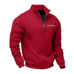 Detail of red fleece sweatshirt with quarter zip stand collar and brown contrast pocket